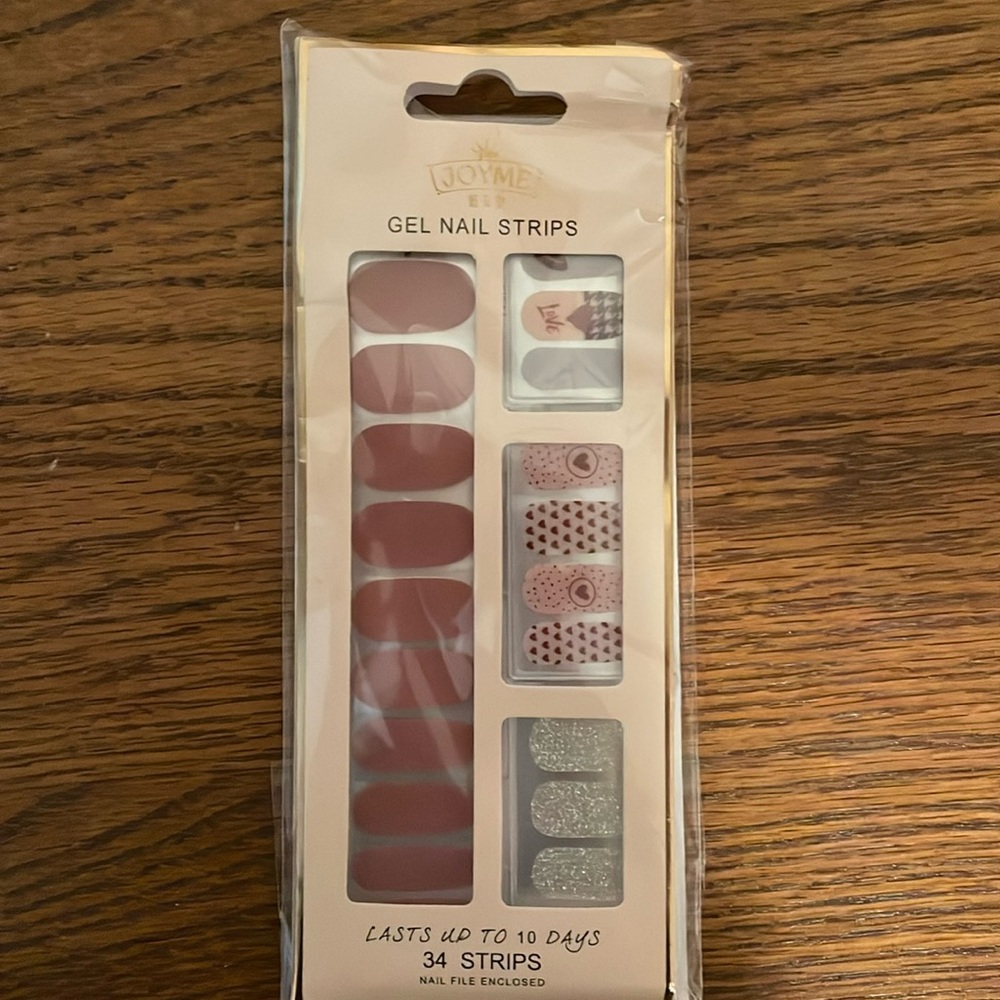 Joyce gel nail strip. New in package . Neutral with hearts and glitter